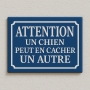 Plaque de rue UN CHIEN PEUT EN CACHER UN AUTRE